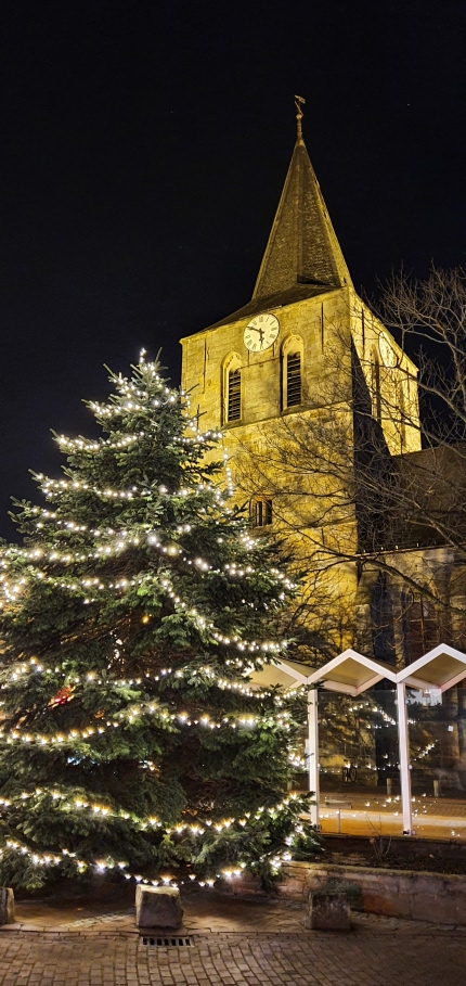 Illuminated church with Christmas tree