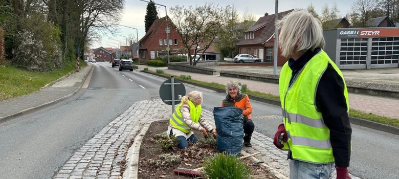 Cleaning the traffic islands in the village